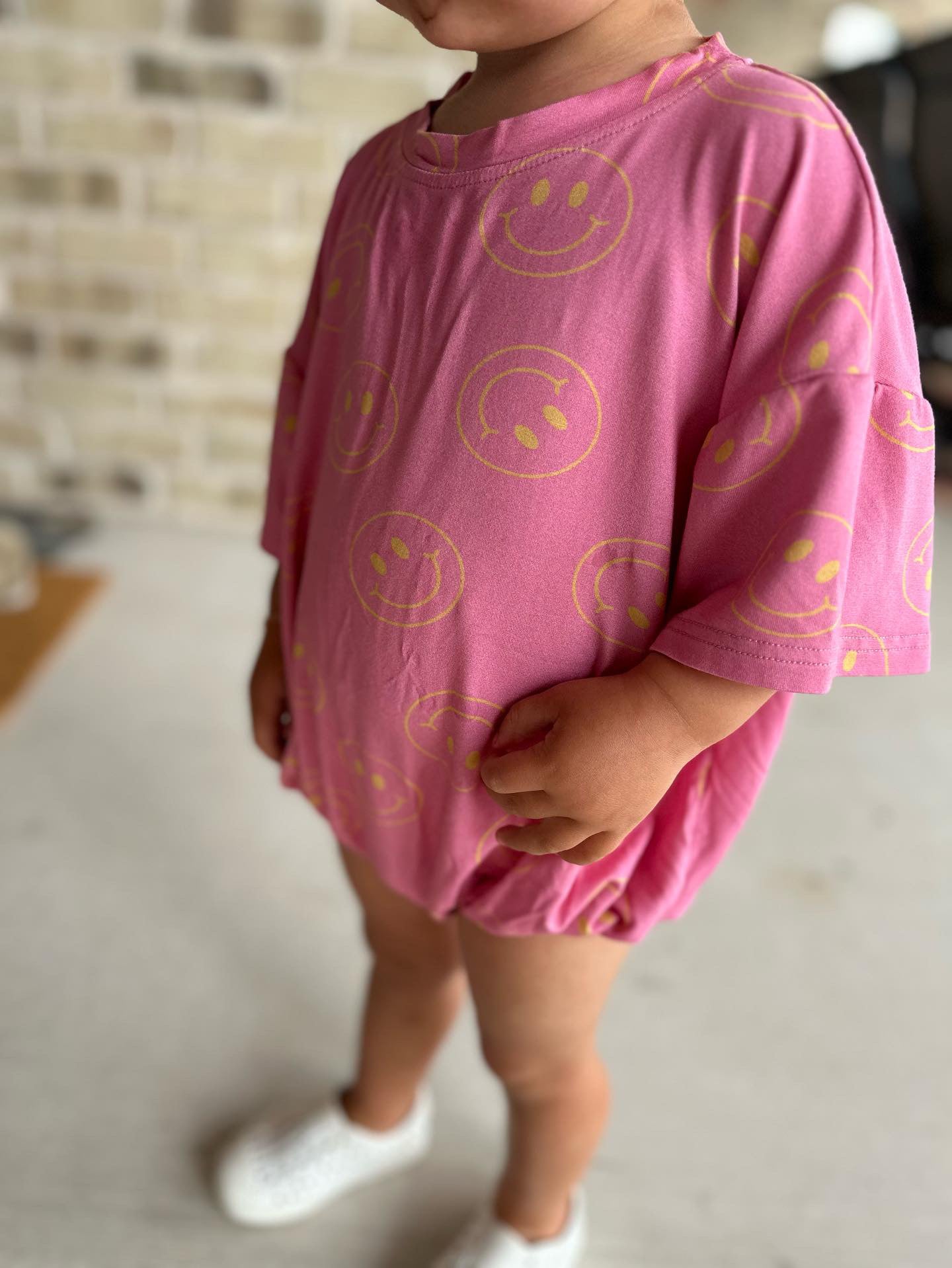 Oversized Pink Smiley Romper